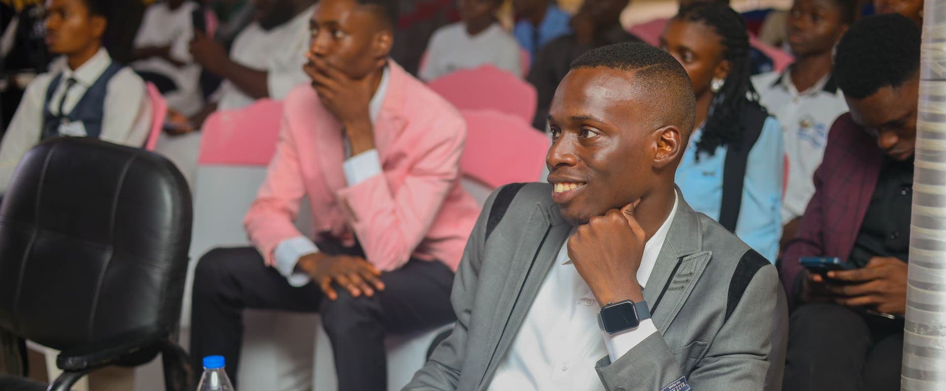 A young member listening intently at MJI's 3F Conference, 2025
